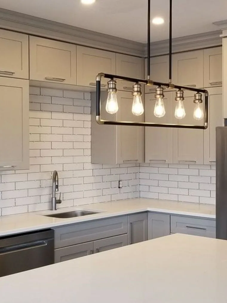 Guelph condo kitchen with crown moulding run to the ceiling and subway tile