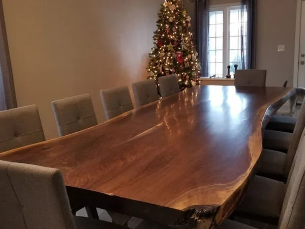 Custom live edge walnut dining table with a natural finished edge